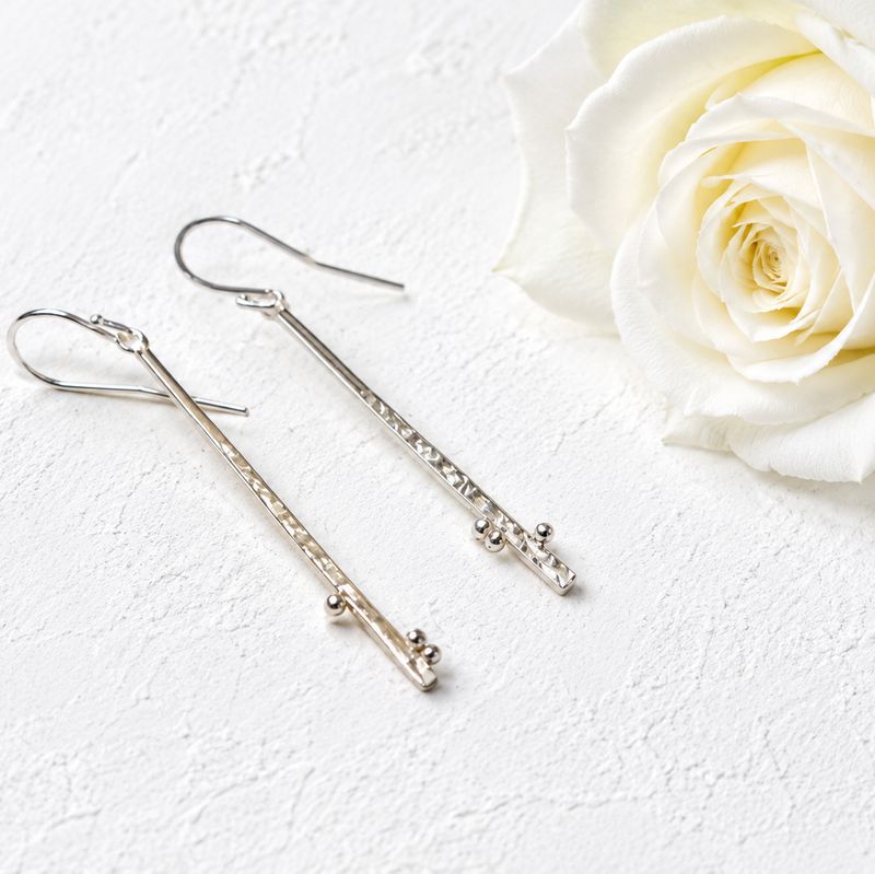 Long, sleek silver drop earrings