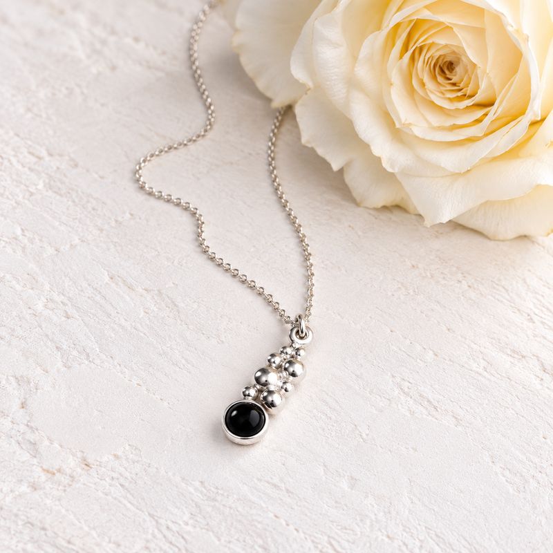 Small pendant with beads and a black onyx stone