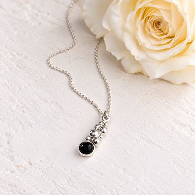 Small pendant with beads and a black onyx stone