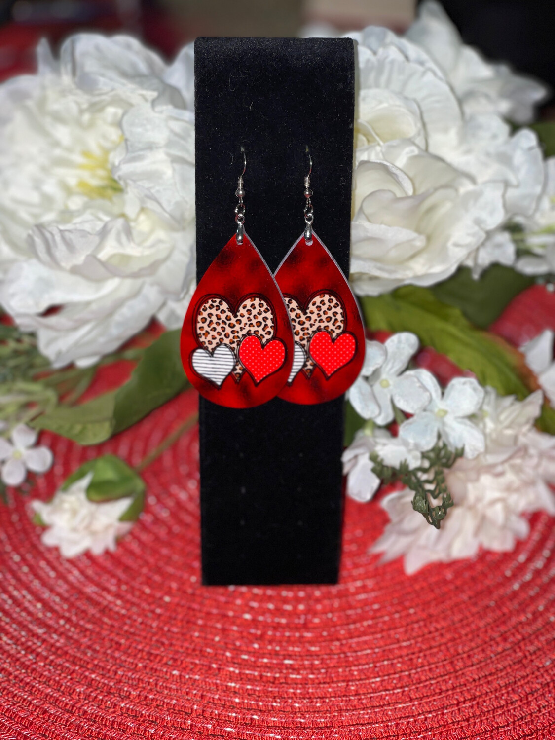 Cheetah Heart Earrings With Red &amp; Black Background.