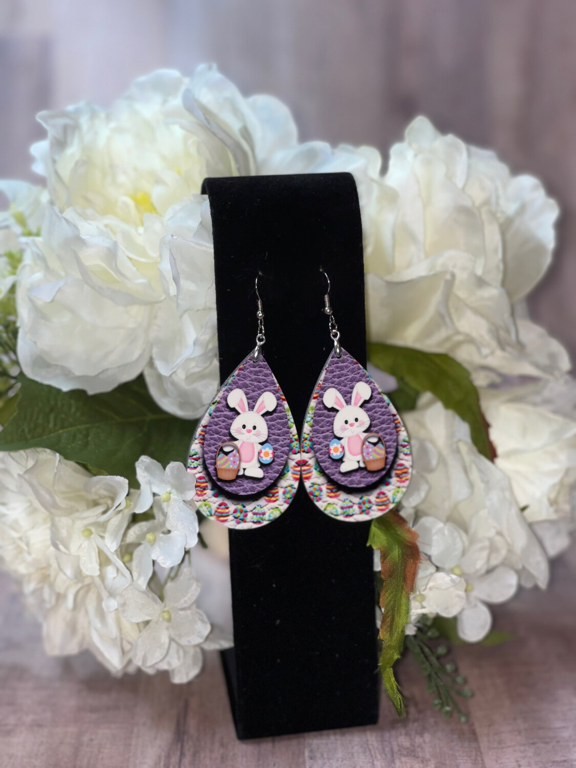 Springtime Easter Bunny Earrings &amp; Colorful Egg Background.