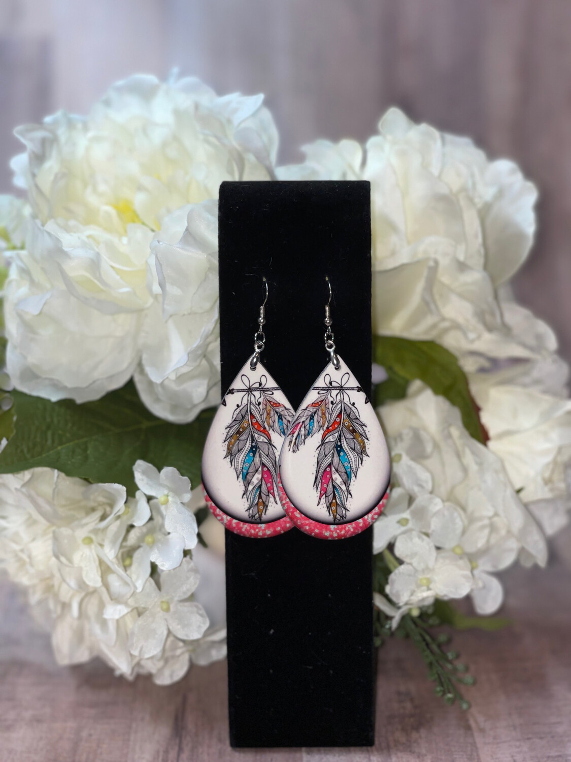 Boho Feather Earrings With Pink Background Trim.