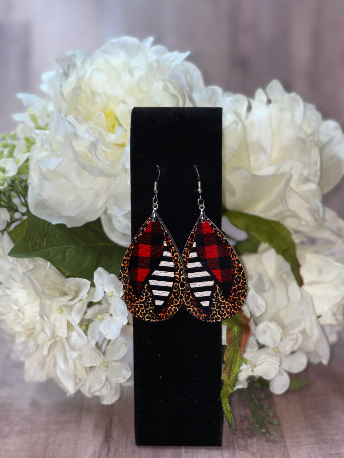 Buffalo Plaid And Black And White Striped Feather Earrings.