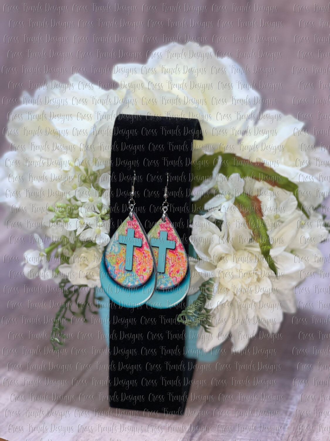Turquoise Cross Layered On Colorful Background