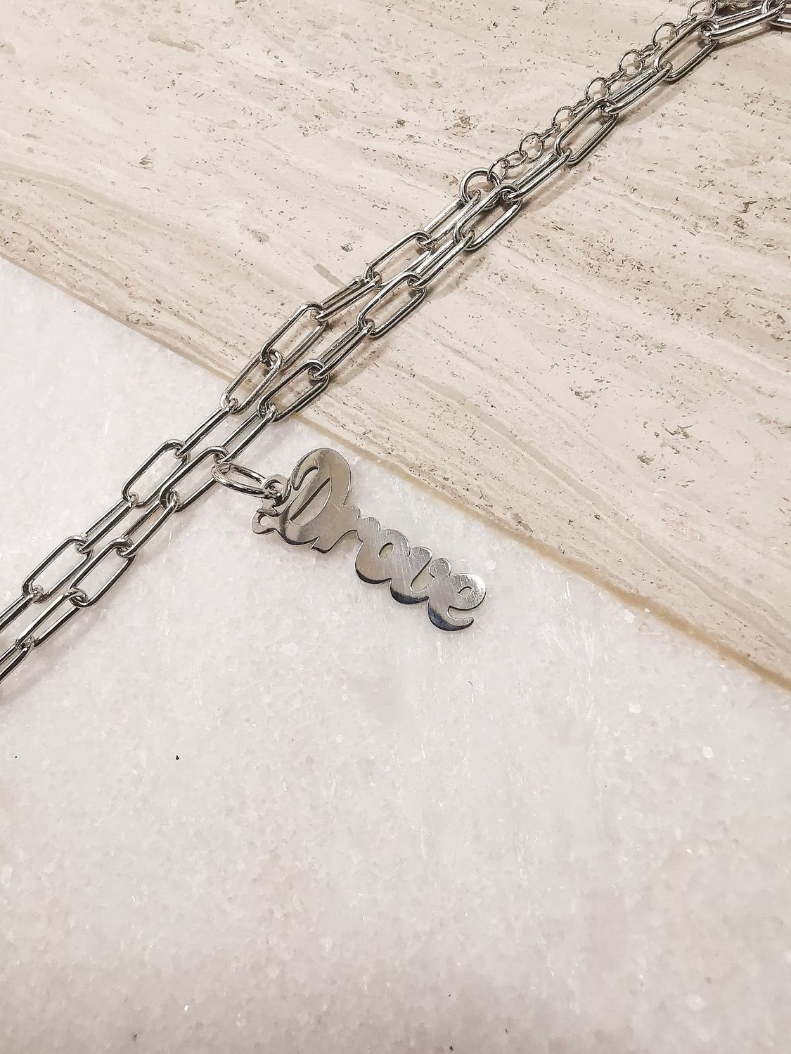 "Drove" Script Charm Rhodium