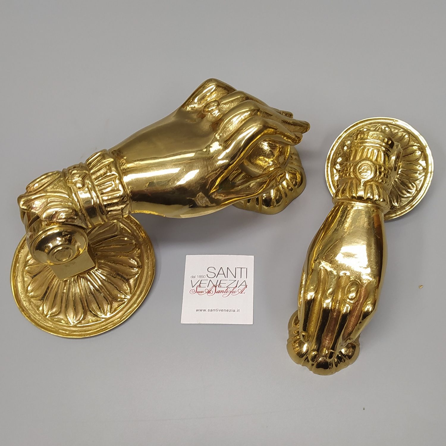 Battente per porta a forma di mano piccola in ottone fuso