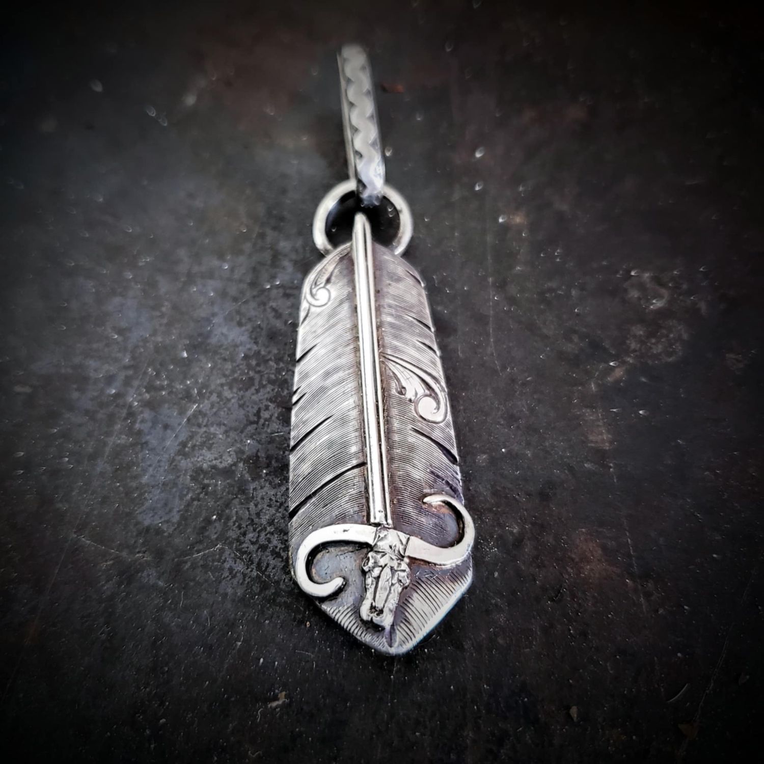 Feather Pendant with a Bullskull