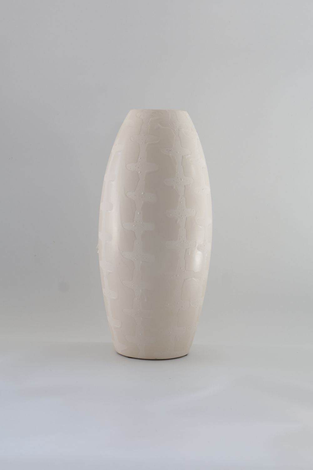 Tall, elongated bullet- or capsule-shaped modern design.