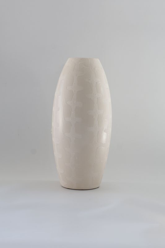 Tall, elongated bullet- or capsule-shaped modern design.