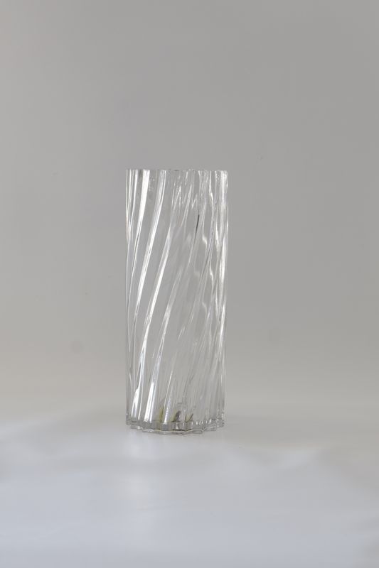 ​Tall, cylindrical twisted glass or spiral-fluted design.