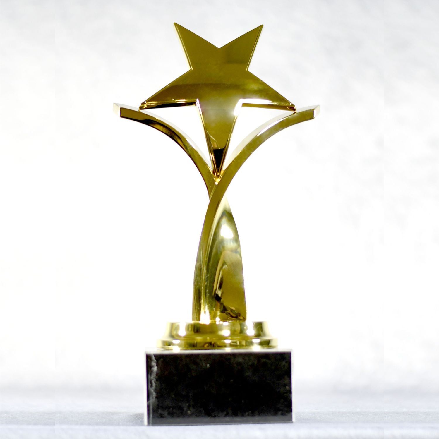 Twisting Star On Black Marble Base, Gold, Silver, Bronze Twisting Star On Black Marble Base, Gold, Silver, Bronze