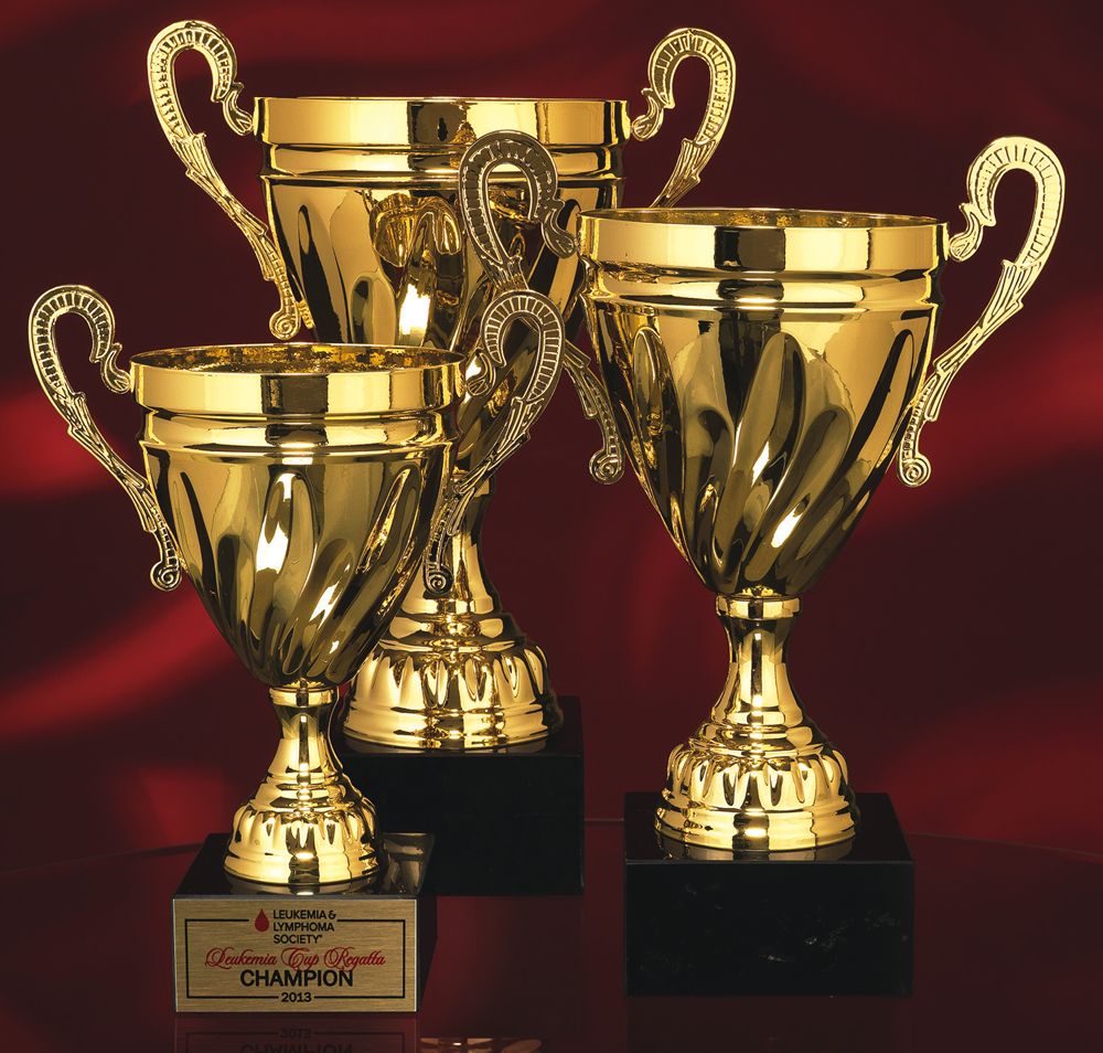 Gold Metal Cup on Black Marble Base Gold Metal Cup on Black Marble Base