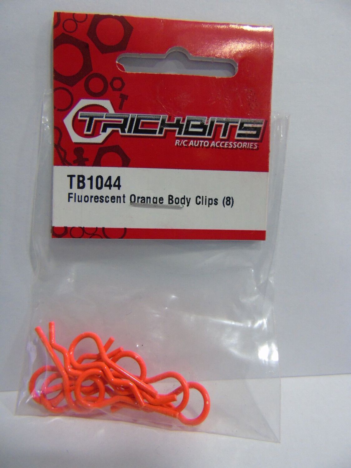 Small fluorescent orange body clips