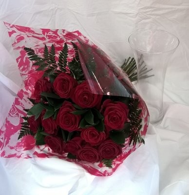 12 Long Stem Red roses and foliage