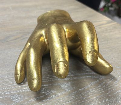 GOLD HAND STATUE