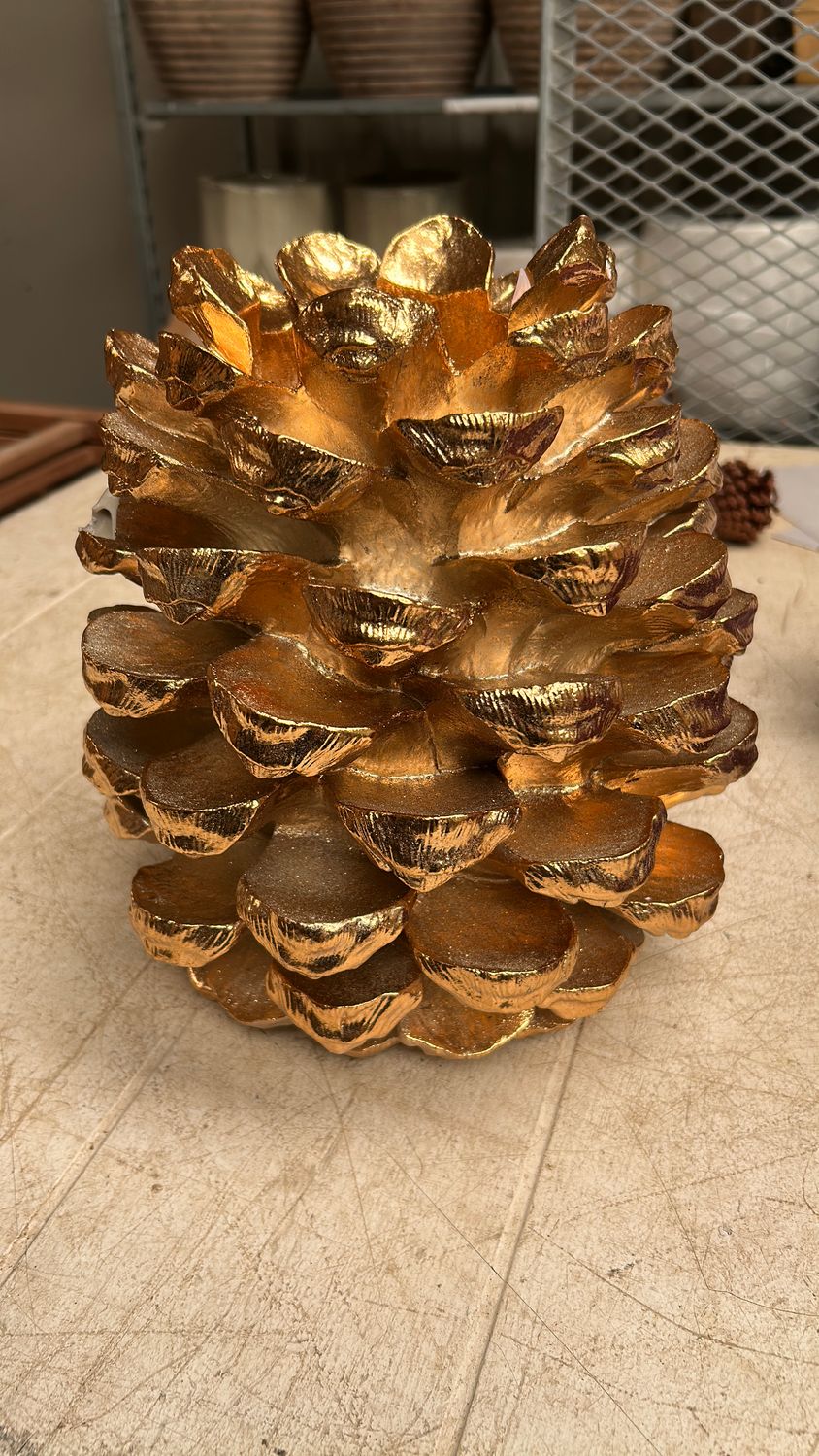 Large gold pinecone candle holder