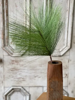 Bursting Pine Spray I 28" green pine stem in a wooden vase, featuring a full and airy pine-inspired look.