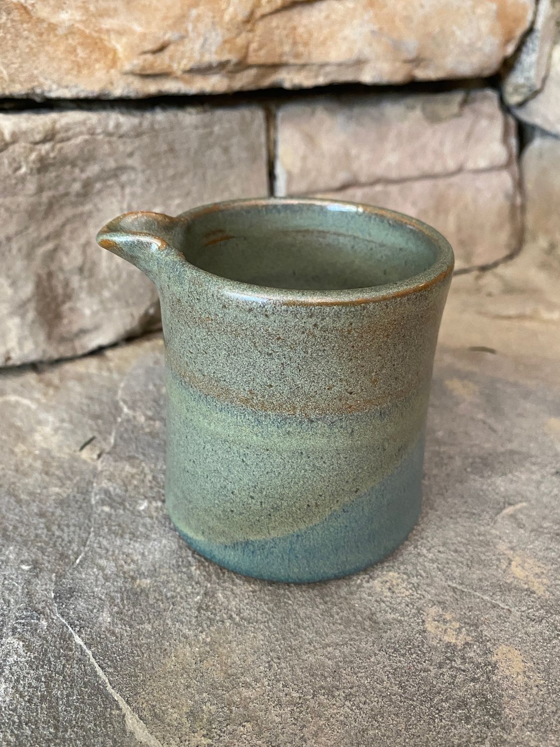 Creamer in blues and greens