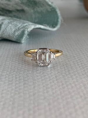 Dominique Emerald Cut Moissanite with Rhombus Cut Diamond Accents 14k White & Yellow Gold Engagement Ring
