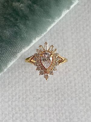 Amaranth Pear Cut .60ct Lab Diamond Center with .625ctw Diamond Halo Flair 14k Yellow Gold Engagement Ring