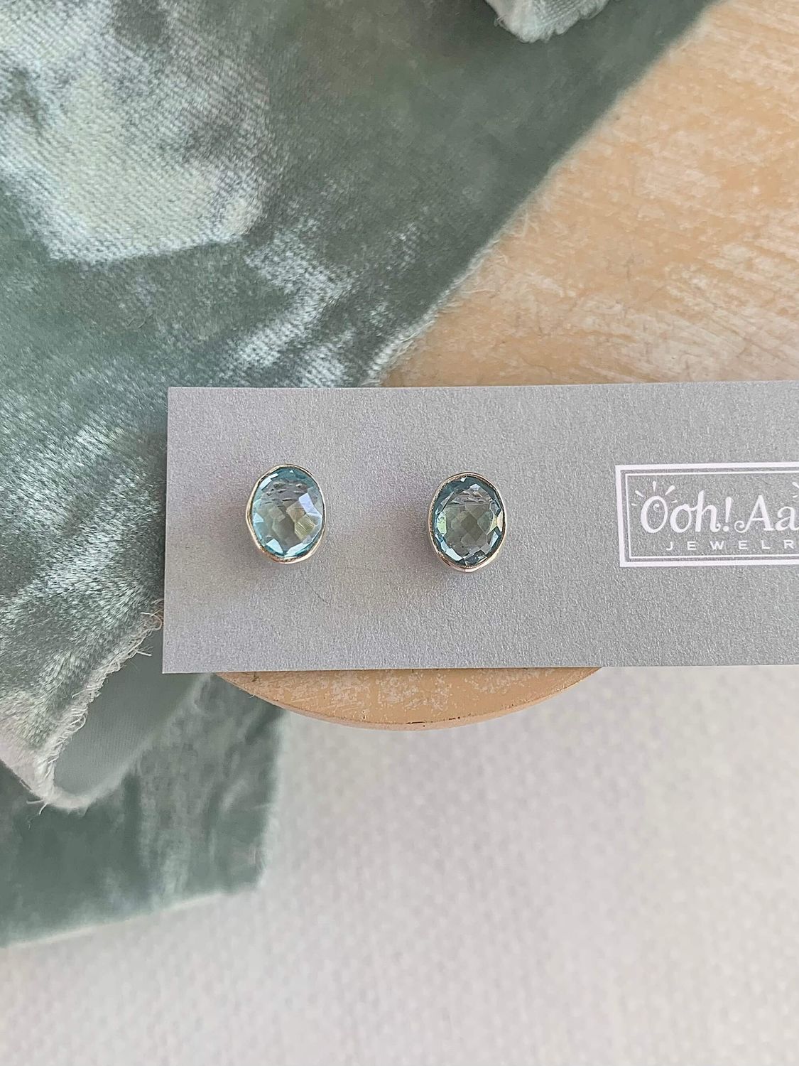 Oval Blue Topaz Full Bezel Set Silver Studs