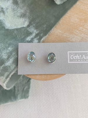 Oval Blue Topaz Full Bezel Set Silver Studs