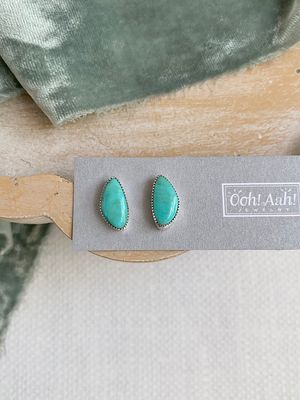oranic shaped turquoise stud with notched silver bezel