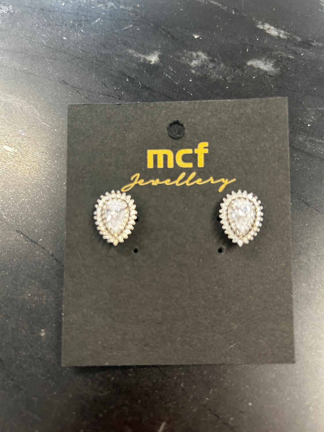 Silvery Teardrop Studs