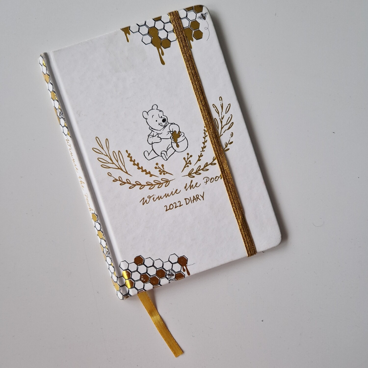 Winnie the Pooh Notebook  (Recycled 2022 Diary) comes with gold elasticated book band