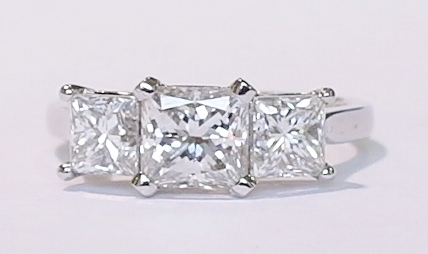 Platinum three-stone princess cut diamond ring