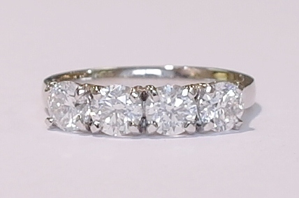 Platinum four-stone diamond ring