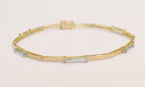 9ct yellow gold blue topaz bracelet