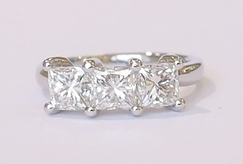 Platinum three-stone princess cut diamond ring