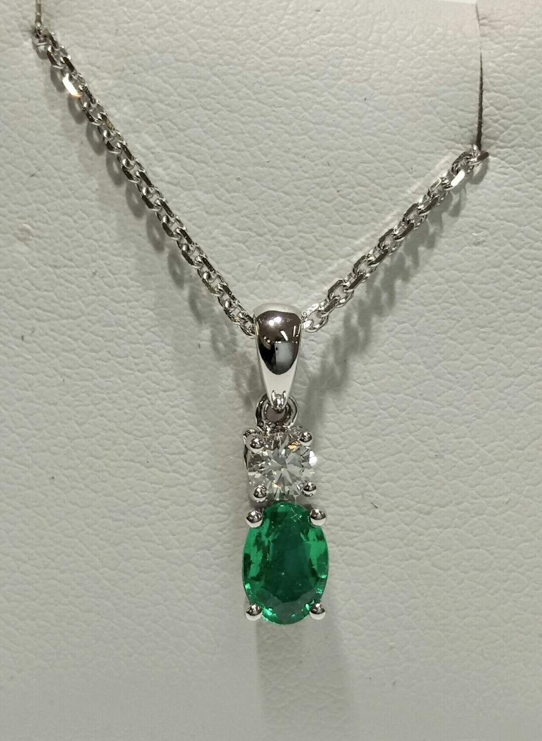 18ct white gold emerald and diamond pendant