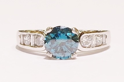 Platinum and blue diamond ring