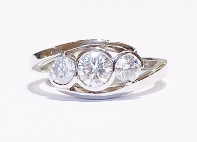 Platinum and diamond three-stone ring
