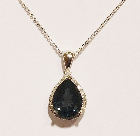 9ct white gold blue topaz and diamond pendant