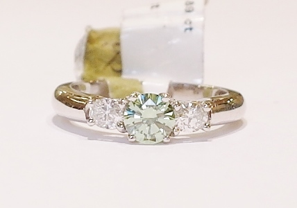 Green diamond three stone ring