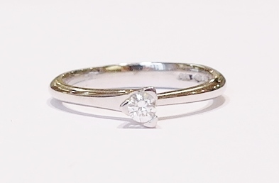 Platinum and diamond solitaire ring