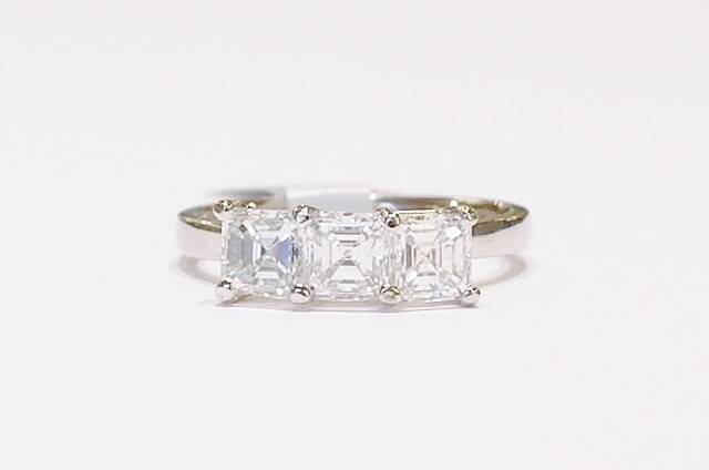 Platinum asscher cut three-stone diamond ring