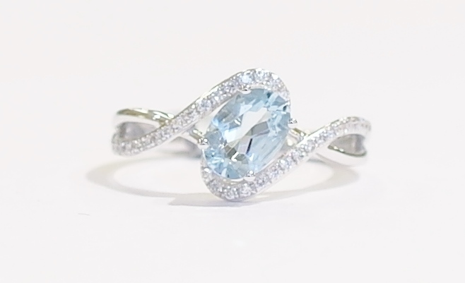 Aquamarine and diamond twist ring