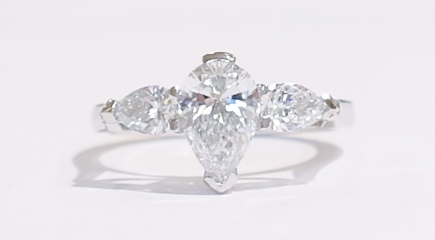 Platinum pear shaped diamond three stone