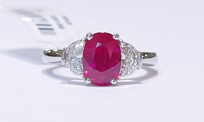 Platinum ruby and diamond three stone ring