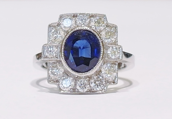 Platinum oval sapphire and diamond cluster ring