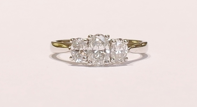 Platinum oval diamond three stone ring