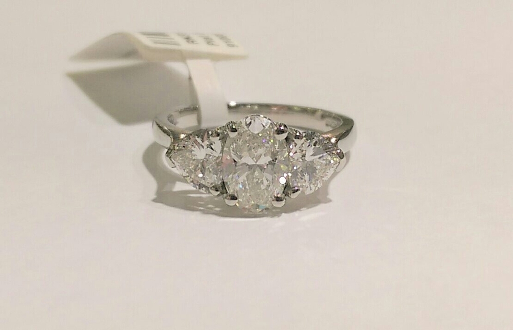 Platinun oval and heart cut diamond three stone ring