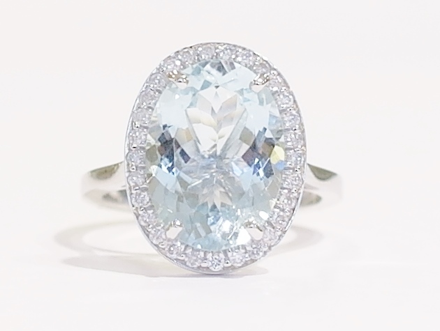 Aquamarine and diamond halo ring