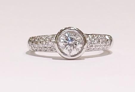 Platinum rubover diamond solitaire