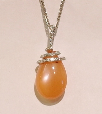 18ct white gold orange moonstone and diamond pendant