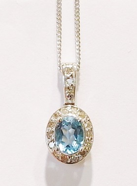 9ct white gold blue topaz and diamond pendant